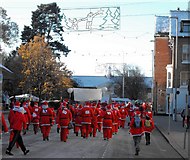 SO1091 : High Street full of Santas by Penny Mayes