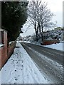 Pavement on a snowy Bedhampton Hill- looking down