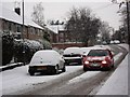 SP2972 : Car moving slowly along Whateleys Drive in the snow by John Brightley