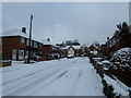 Looking up a snowy Waverley Road towards Aldsworth Close