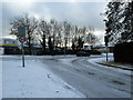 Looking from a snowy Waterworks Road out into Fitzherbert Road