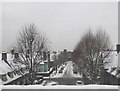 TQ2181 : East Acton rooftops and street in snow by David Hawgood