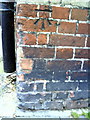 Benchmark on building at junction of Helen Lane and Maiden Street