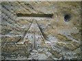 Ordnance Survey 1GL Bolt (Ref. BT2040) carved in south west face of tower at St John the Baptist Church, Penshurst, Kent