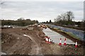 Flood alleviation works continue on a bright cloudy day