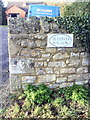 Benchmark on wall at entrance to The Paddock Bungalow