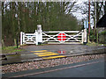 TM0392 : View across the level crossing in Hargham Heath by Evelyn Simak