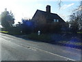 Chester Road with milepost at Glebe Cottages