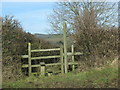 A stile marks the point where the footpath to Stockland leaves the road