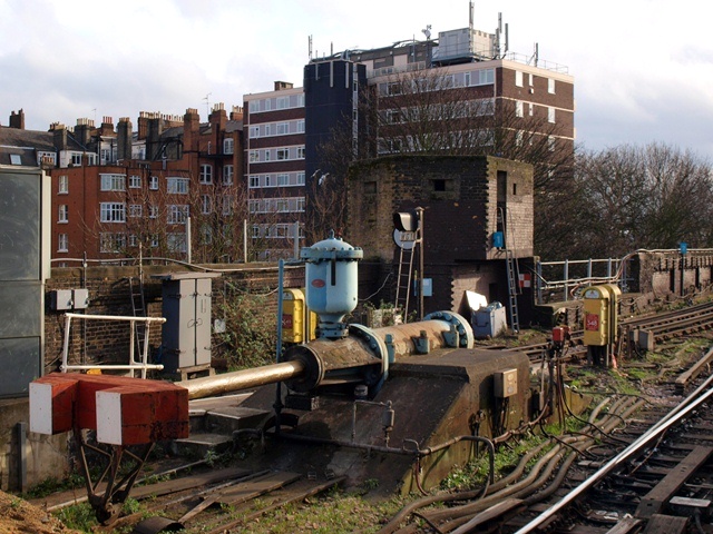 Hydraulic buffers and war-time pill box at Putney Underground Station in Fulham