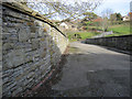 Bridge over the former Holywell Town station, and a bench mark