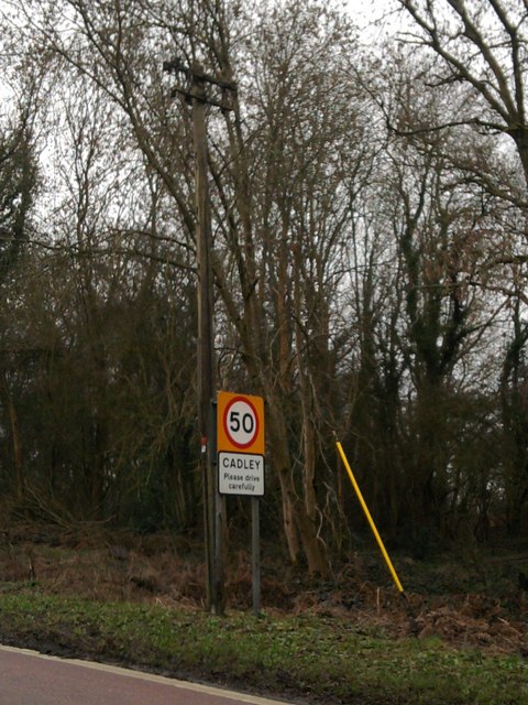 Cadley sign with a telegraph pole above