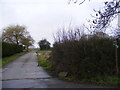 TM4065 : Footpath to the U2411 & entrance to Redhouse Farm by Geographer