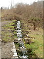 Small stepped waterfall adjacent to the Guardian of the Valleys, Six Bells