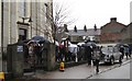 Friends and relatives waiting to greet the newly weds on their emergence from church