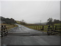NT3911 : Minor road crossing a cattle grid at  Hosecote by James Denham