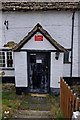 Axe & Compass (3) - entrance door, High Street, Kempsford