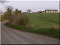 Buildings at Travers Farm seen from the lane to Well