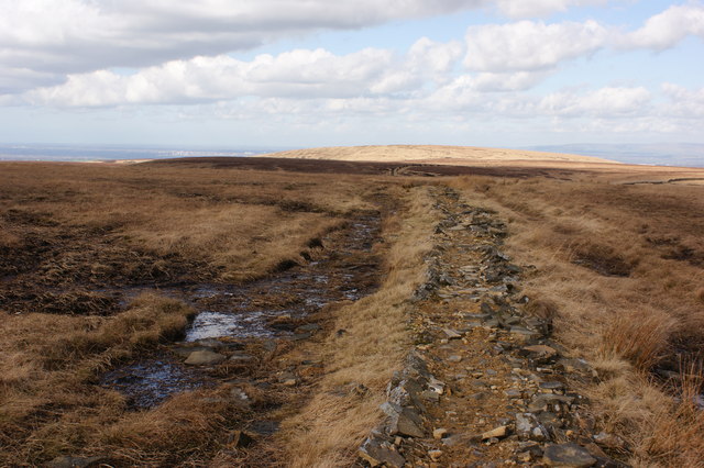 The remains of the wall serve as a very acceptable causeway through the mud