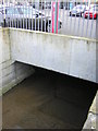 Chaffinch Brook emerges briefly from culvert