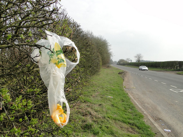 Discarded plastic bag and orange peel on the A140