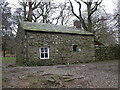 NY1221 : Bothy in Holme Wood by Peter Bond