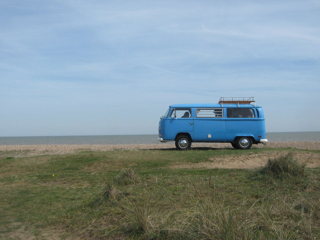 Blue VW Camper Van on the sea wall