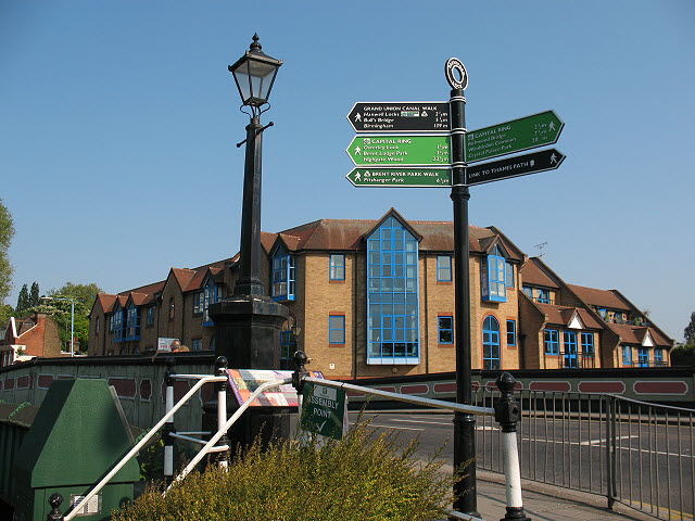Signpost and lamppost by Brentford Bridge