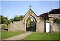 NZ0810 : Archway access to Barningham Church by Stanley Howe