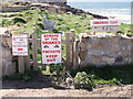 Warning signs at Sennen Cove