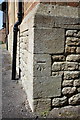 Benchmark on the Head Office of Bramleys Nurseries, School Road