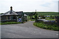 Lodge and gateway at the entrance to the Wallog House Estate