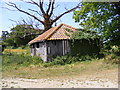 TM3556 : Barn next to the footpath to Old Barn Cottages by Geographer