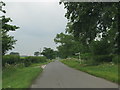 The road (along the line of the Fosse Way) passes the turning to Farleaze