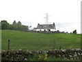 Croft below the power lines near Black Dyke