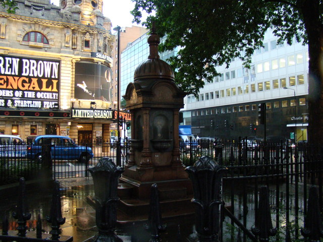 View of an old drinking fountain in the centre of St Giles Circus
