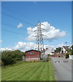 ACF hut dwarfed by pylon, Sofrydd