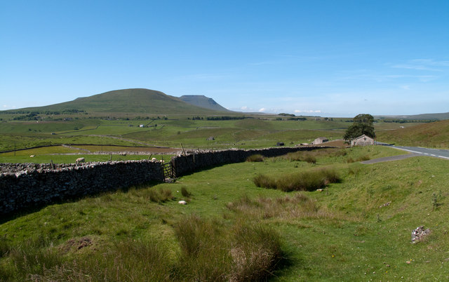 Wall and farmland beside B6255
