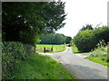 Approaching a road and path junction in Church Lane