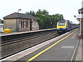 A high speed train passing through West Drayton Station