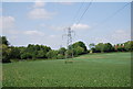 Pylons crossing an arable field