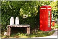 Milk churns and phone box