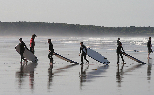 Surfers at Belhaven Bay