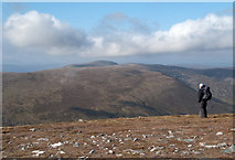 NH3786 : Sparse vegetation and stones at summit of An Socach by Trevor Littlewood