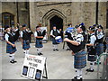 NZ2742 : Pipe Band entertaining tourists in Market Place by rob bishop