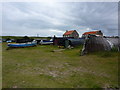 NU1241 : Boat sheds and boats, The Ouse, Holy Island by Alexander P Kapp