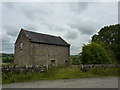 Barn with footpath sign