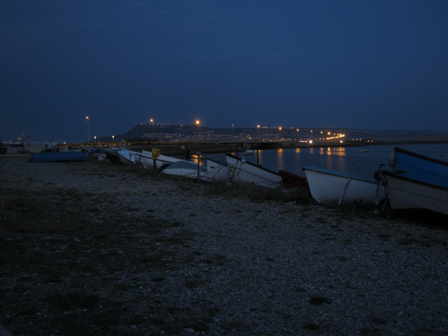Beached boats on the Fleet at dusk