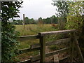 Stile onto fenced path