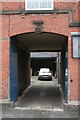 Archway into factory courtyard